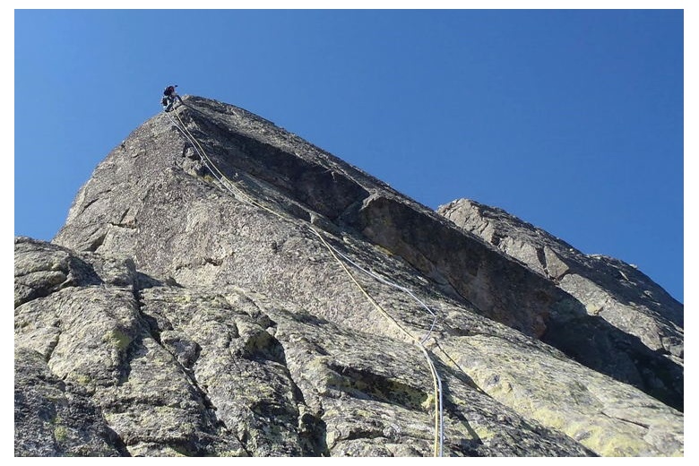 climber in the last stretch of the route to les agulles dellui